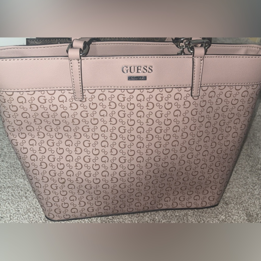Pink Medium Guess purse.